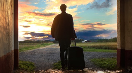 man traveling with suitcase