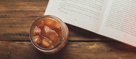 mason jar drink with book