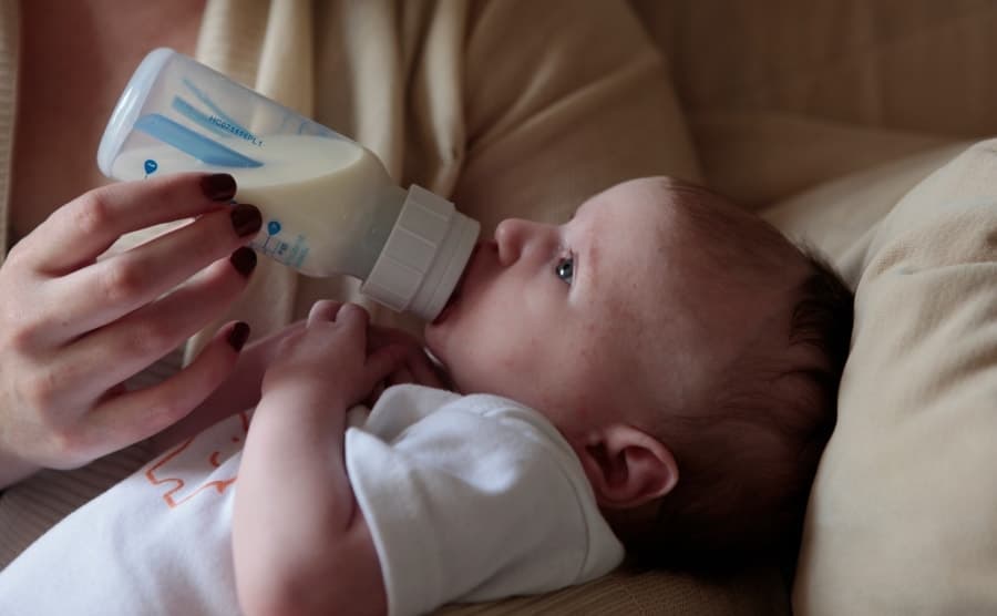 Baby drinking from baby bottle