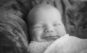 Smiling baby in blanket