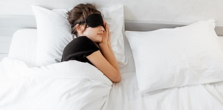 Woman sleeping with bamboo sheets