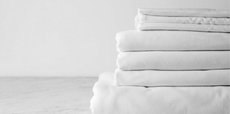 White bamboo bed sheets stacked